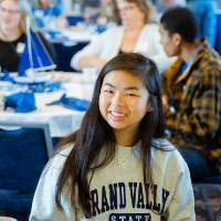 Three Alumni enjoying conversation at the table at the Laker Legacy Brunch